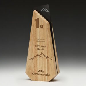 Angular timber corporate awards trophy with engraved first place text and black glass accent panel