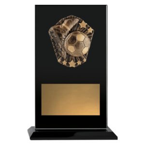 Small black glass award plaque featuring raised bronze soccer boot and ball design with star accents and wide gold engraving plate, set on matching black base.