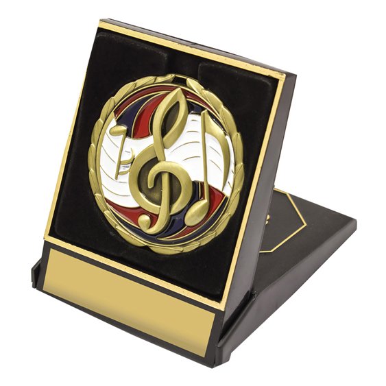 Black hinged presentation box with gold trim featuring a music themed medal insert and front engraving plate for custom award details.