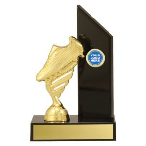 Small black vertical panel trophy with gold soccer boot feature, round logo insert and gold engraving plate on black base.