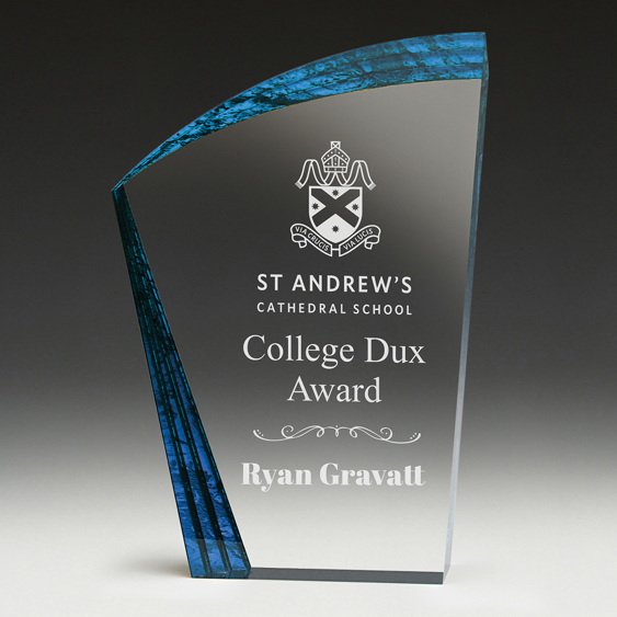Clear glass corporate awards plaque with curved blue accent panel and engraved school award text