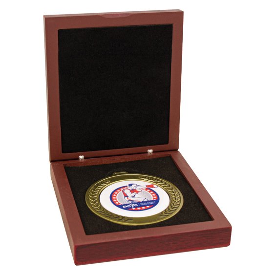Gold boxing medal with laurel wreath border and custom colour centre insert, displayed in a hinged wooden presentation box with black foam interior for secure storage and formal award ceremonies.