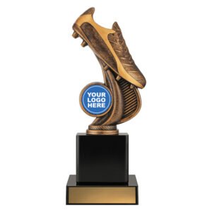 Medium bronze soccer trophy featuring angled football boot above curved textured support with 25mm insert position, mounted on tall black base with engraving plate area.