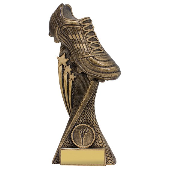 Large bronze soccer trophy featuring raised football boot with star accents and textured curved column, mounted on solid base with engraving plate area.