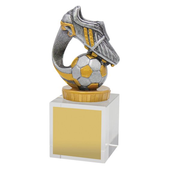 Large clear crystal cube award with silver and gold soccer boot and ball figure on top and front engraving plate.