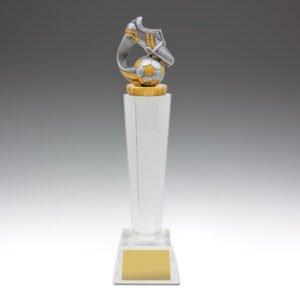 Small clear crystal pedestal soccer trophy with silver and gold boot and ball figure on square crystal base.
