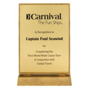 Gold engraved glass plaque award on display stand with printed recognition text