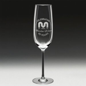 Engraved champagne glass with anniversary celebration logo and text