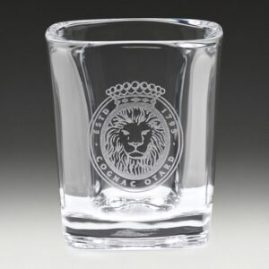 Square whisky tumbler with thick base and engraved lion crest logo on front