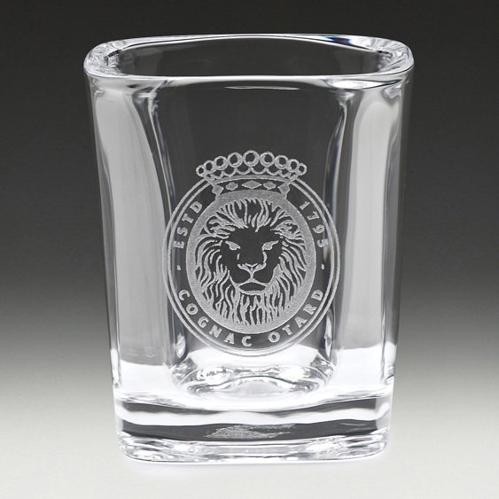 Square whisky tumbler with thick base and engraved lion crest logo on front