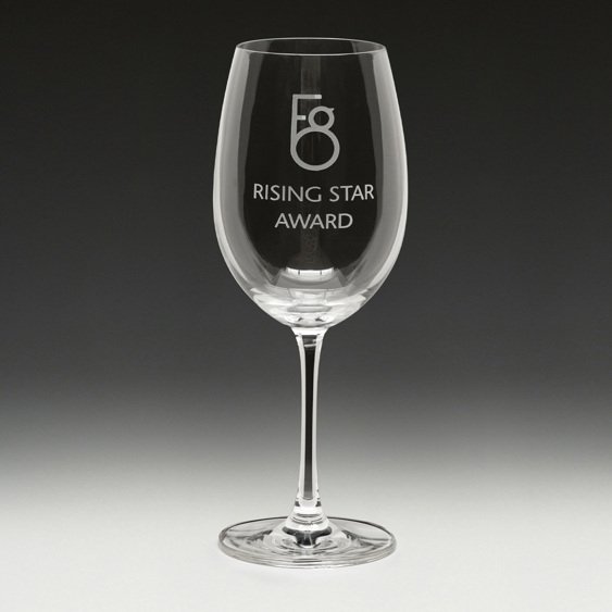 Engraved wine glass with rising star award text and logo design