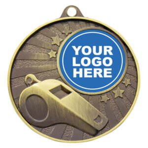 Gold whistle medal with raised whistle design and starburst pattern background featuring logo insert area