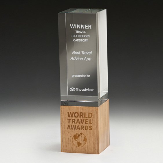 Large tall rectangular glass corporate awards trophy with engraved text mounted on natural timber block base