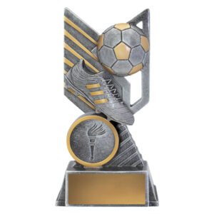 Small silver and gold soccer trophy featuring raised football and boot design with angled abstract backdrop, circular insert area and gold engraving plate on stepped base.