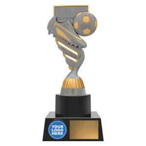 Silver and gold soccer trophy with spiral column, boot and ball in front of goal net, circular logo insert on base, and blank gold nameplate.