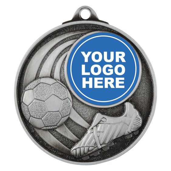 Silver soccer medal with boot, ball, curved stripe design, and centre logo insert.