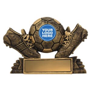 Antique gold soccer trophy with two boots flanking a ball and centre logo insert on engraved base.