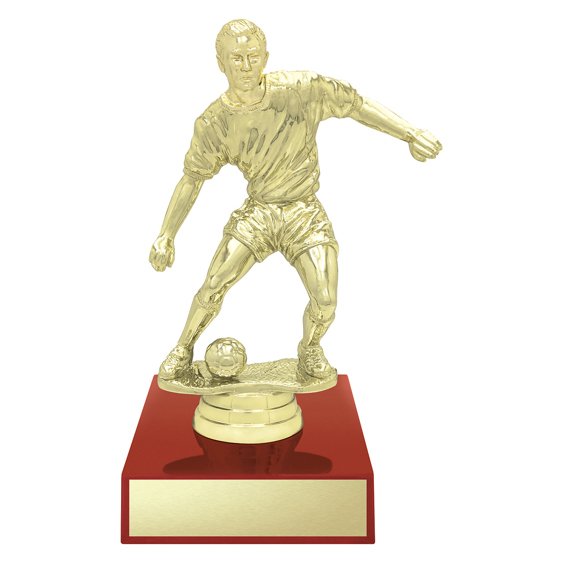 Small gold soccer player trophy figure on red base with engraving plate.