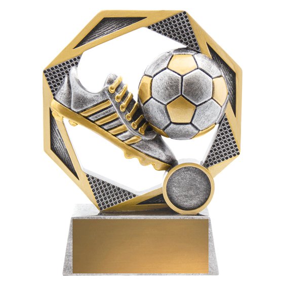 Small silver and gold soccer trophy with boot and ball inside hexagon frame on rectangular base.