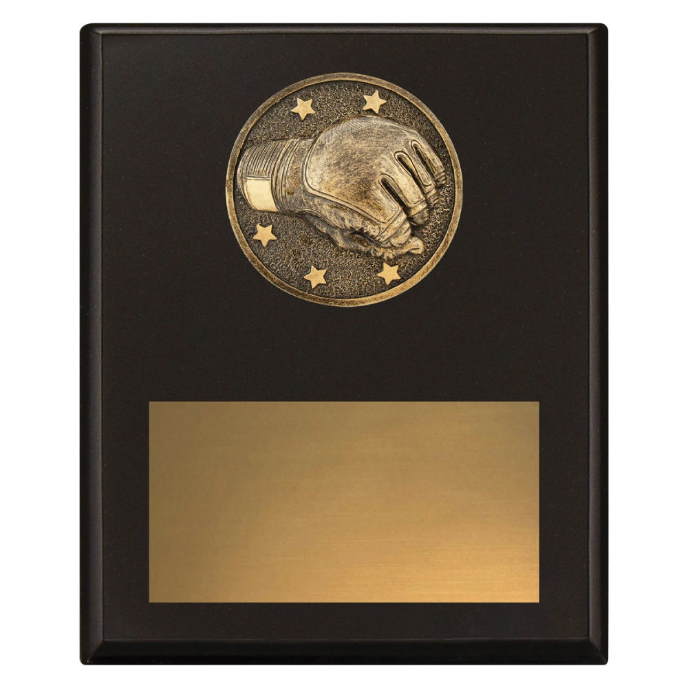 Large black wrestling award plaque with raised wrestling glove emblem and large gold engraving plate