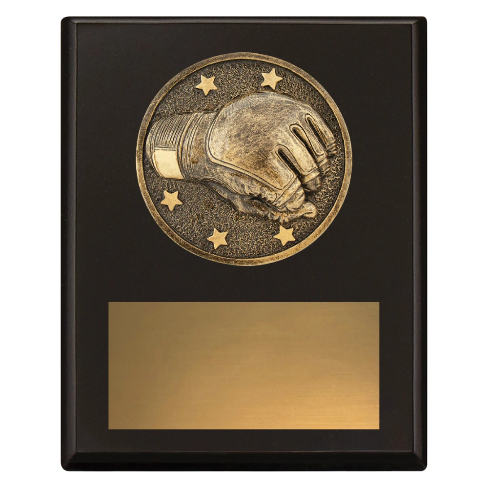 Small black wrestling award plaque with raised wrestling glove emblem and large gold engraving plate
