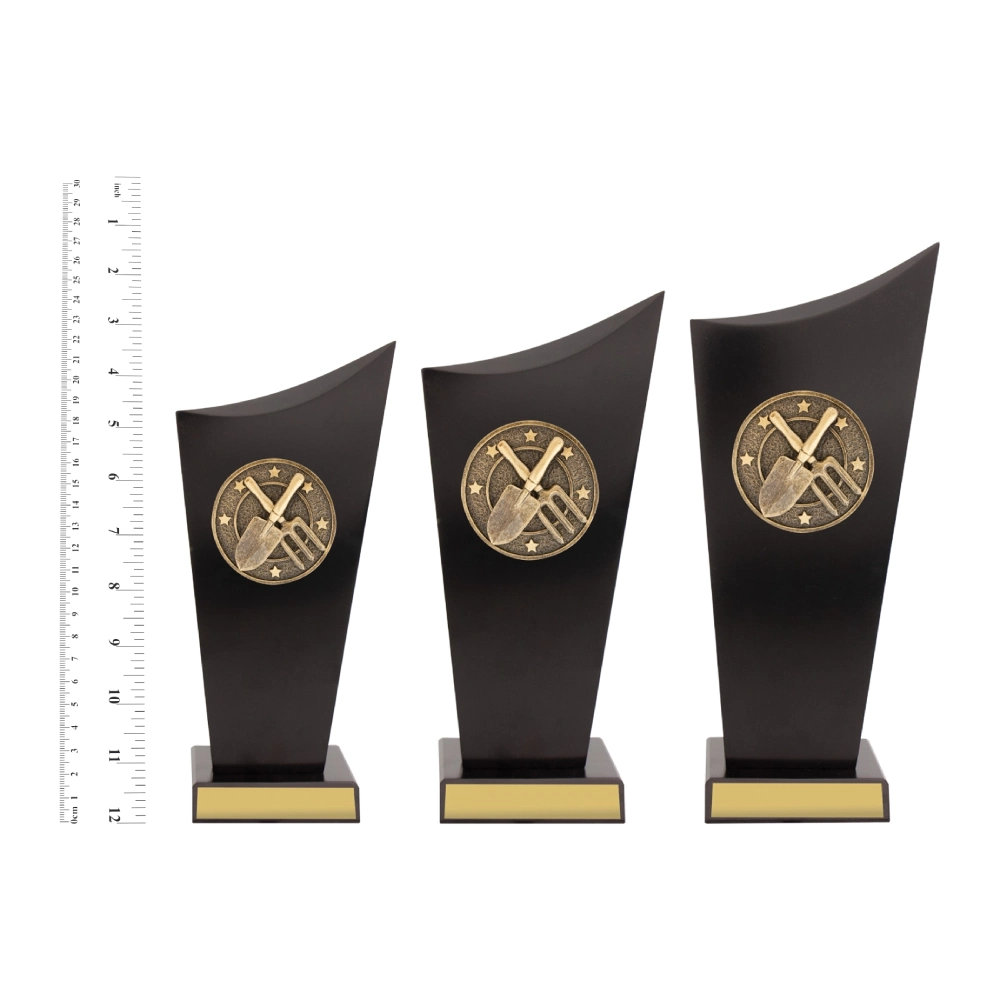 Gardening Spartan Crest trophies next to ruler