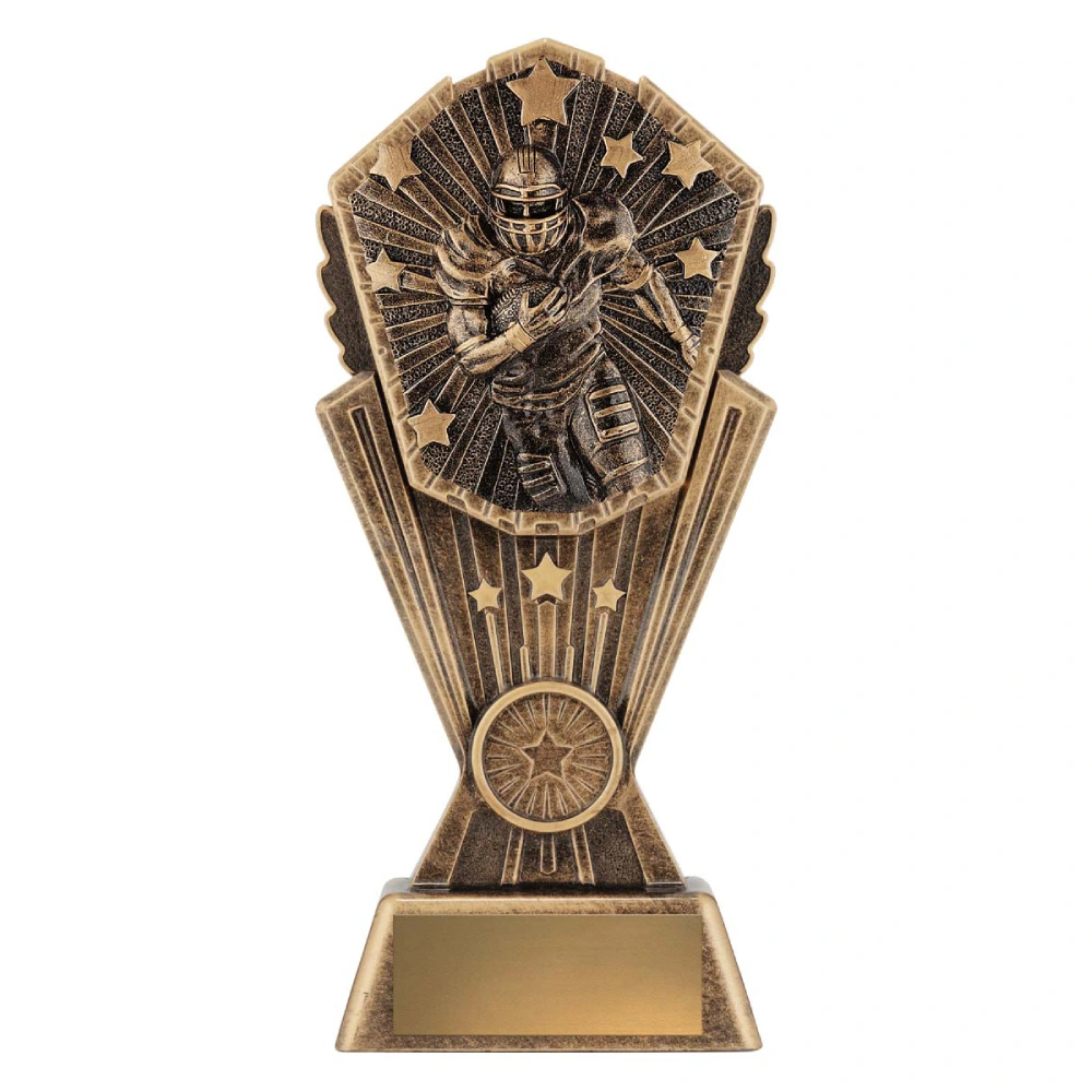 Large American football trophy with running player, starburst background, and engraving plate on base