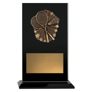 Badminton glass plaque trophy with black panel and gold emblem showing crossed rackets and shuttlecock on base with engraving plate