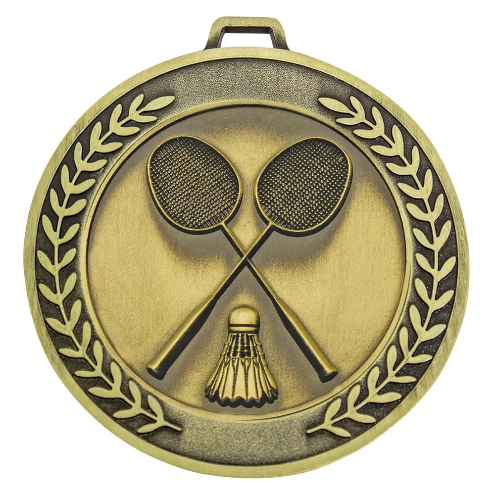 Gold badminton medal with crossed rackets and shuttlecock framed by a laurel wreath border