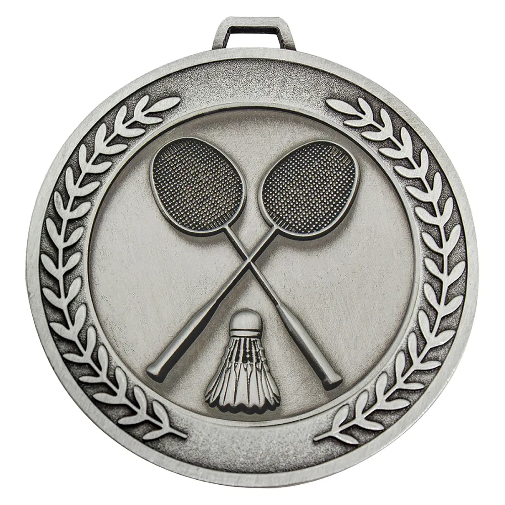 Silver badminton medal with crossed rackets and shuttlecock framed by a laurel wreath border