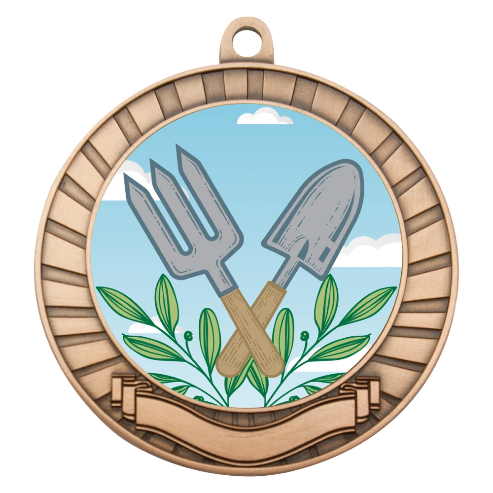 Bronze gardening medal with circular insert featuring crossed hand fork and trowel with leaf detail, radiating border pattern and blank ribbon panel at base