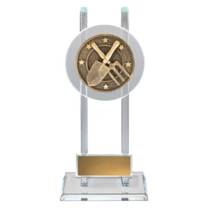 Clear glass gardening trophy with circular medallion featuring crossed hand fork and trowel, supported by twin vertical glass pillars and mounted on a rectangular glass base with engraving plate