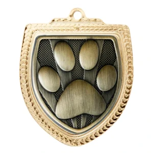 Gold dog paw medal in shield shape with textured border and raised paw design
