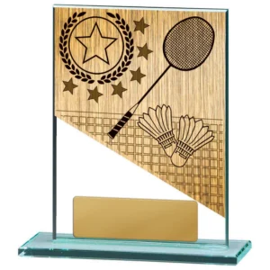 Small glass badminton award with engraved wood effect design, racket and shuttlecock detail, and gold engraving plate on clear glass base