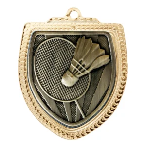 Gold badminton medal with shield shape, raised shuttlecock and racket detail, and textured border