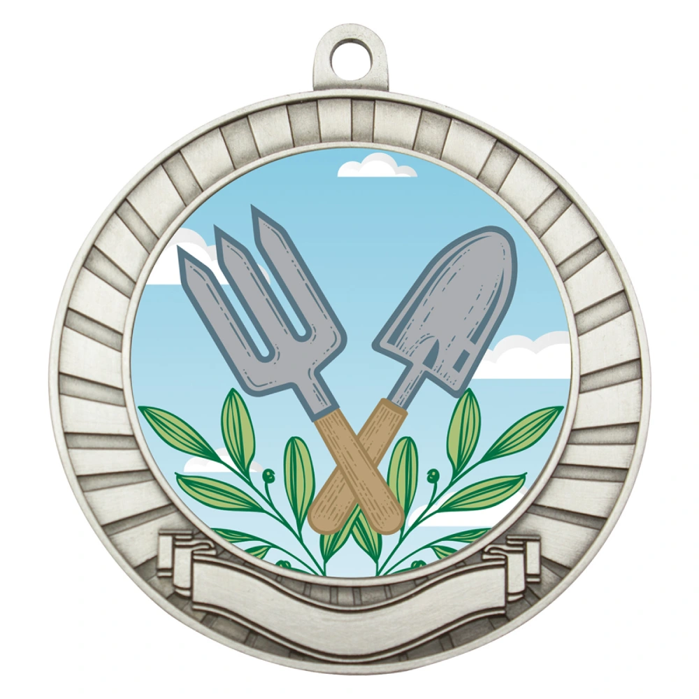 Silver gardening medal with circular insert featuring crossed hand fork and trowel with leaf detail, radiating border pattern and blank ribbon panel at base