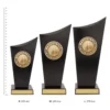 Basketball Spartan Crest Basketball Spartan Crest trophies next to ruler