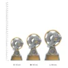 Football Pearl Football Pearl trophies next to ruler