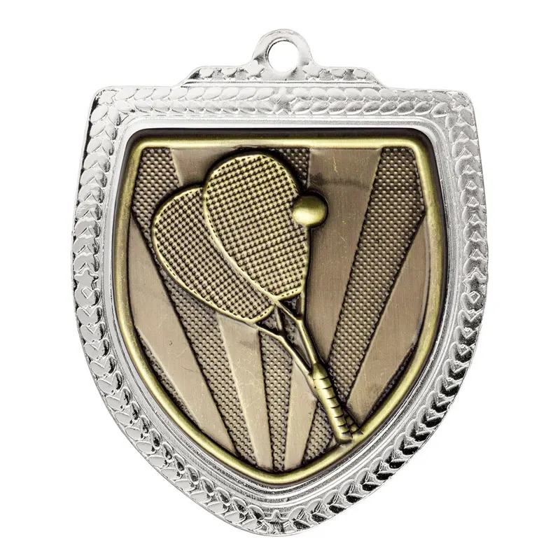 Squash Shield silver next to ruler