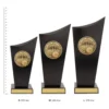 Tenpin Spartan Crest trophies next to ruler