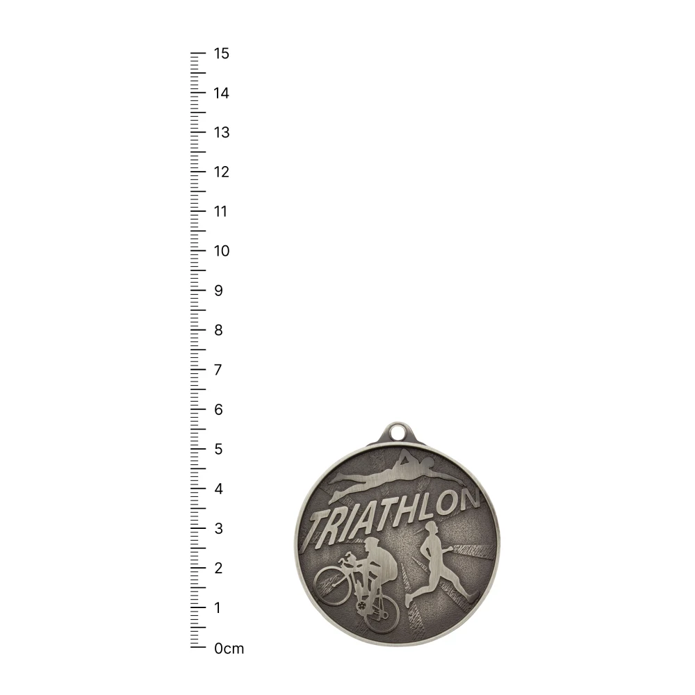 Triathlon Medal silver Triathlon Medal silver next to ruler