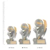 Volleyball Shazam trophies next to ruler Volleyball Shazam trophies next to ruler