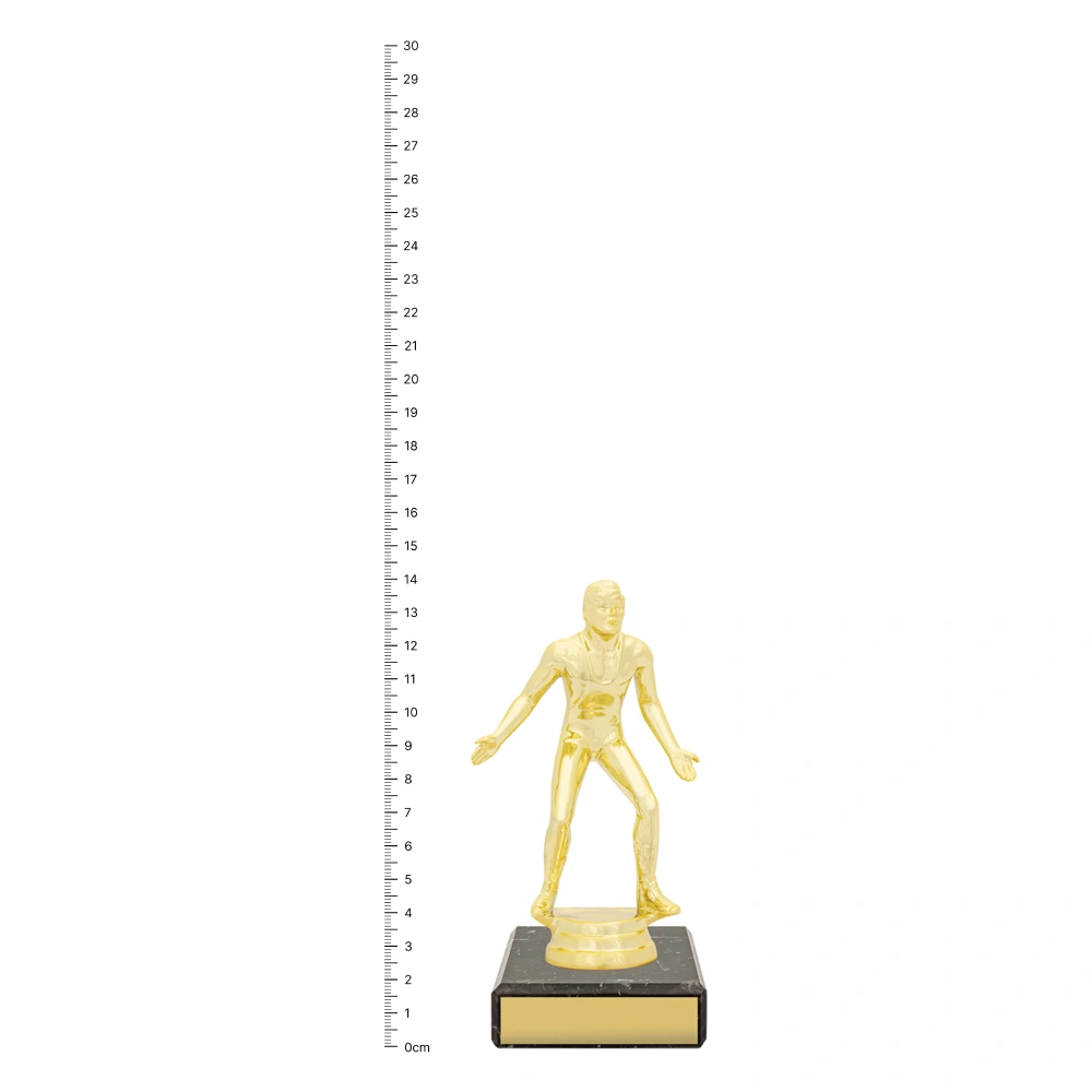 Wrestling Figure Trophy next to ruler