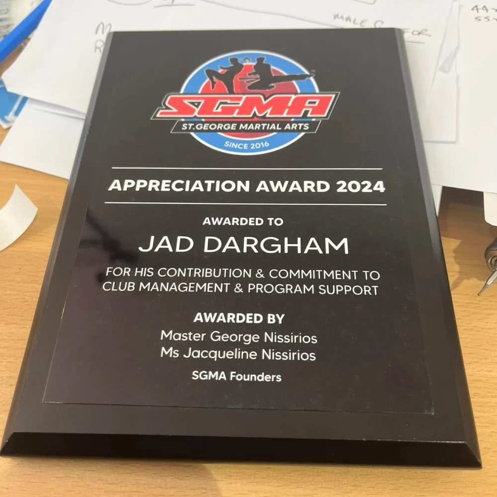 Black appreciation award plaque for St. George Martial Arts presented to Jad Dargham for contribution and commitment to club management and program support in 2024