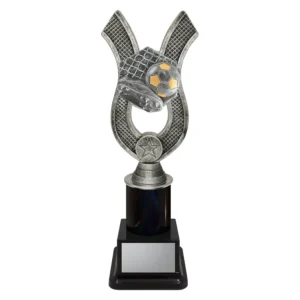 black and silver trophy boot, ball and net on a black base.