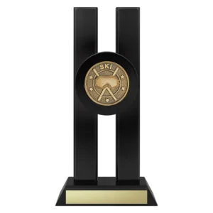 skiing trophy with mask and poles emblem on a black base.